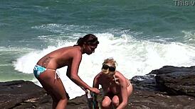 Two Hot Lesbians Lick Pussies and Fuck on Beach for Voyeurs