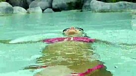 hot monika fox slips into her pink bikini, swims seductively in the pool then struts freely outdoors