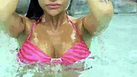 hot monika fox slips into her pink bikini, swims seductively in the pool then struts freely outdoors