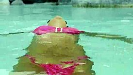 hot monika fox slips into her pink bikini, swims seductively in the pool then struts freely outdoors