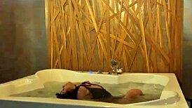 Petite Brunette Teases Small Tits and Narrow Ass in Steamy Jacuzzi