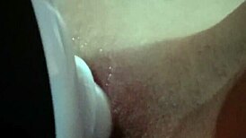 vibrator buzzing right on her wet shaved pussy lips