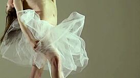 blonde gymnast stretches flexible body in gym yoga poses