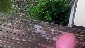 guy jerks off solo cumshot outdoors in wild public spot