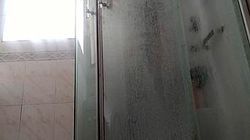 a guy showers stroking his massive monster cock teasingly