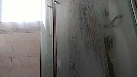 a guy showers stroking his massive monster cock teasingly