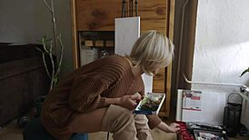 damn this sexy blonde babe paints her pretty pussy flower with glasses on