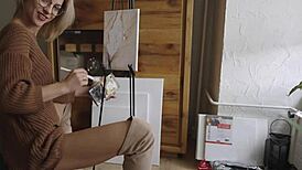 damn this sexy blonde babe paints her pretty pussy flower with glasses on