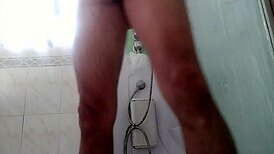 a guy showers stroking his massive monster cock teasingly