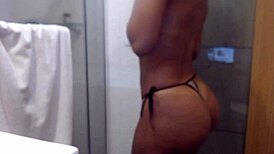 naughty ebony teen dances teases big ass and pussy in steamy webcam bath