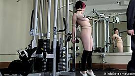 redhead slave gets roughly toyed in tight gym bondage