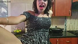 Petite homemade upskirt flashes tight pussy legs on kitchen countertop while smoking