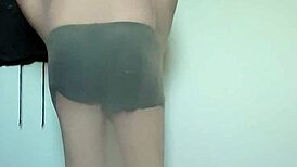 Carmen nylonjunge slips into full body nylons for barefoot fetish tease