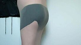 Carmen nylonjunge slips into full body nylons for barefoot fetish tease