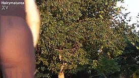 😏 ever seen a hairy mature flash her fat pussy outdoors? see through tease!