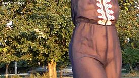 😏 ever seen a hairy mature flash her fat pussy outdoors? see through tease!