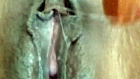 Horny girl fucks her juicy pussy close-up creamy