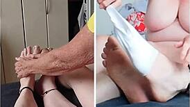 Naked old woman massages sweaty feet