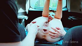Hard anal fisting in the trunk of a car closeup