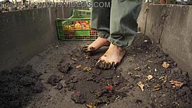 bare feet press tomatoes in the dirt slowly