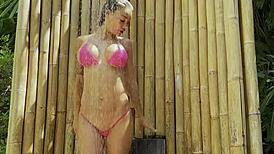 hot monika fox poses in pink bikini outdoors