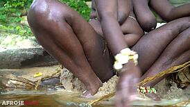 Busty African Teases Naked In River Forest